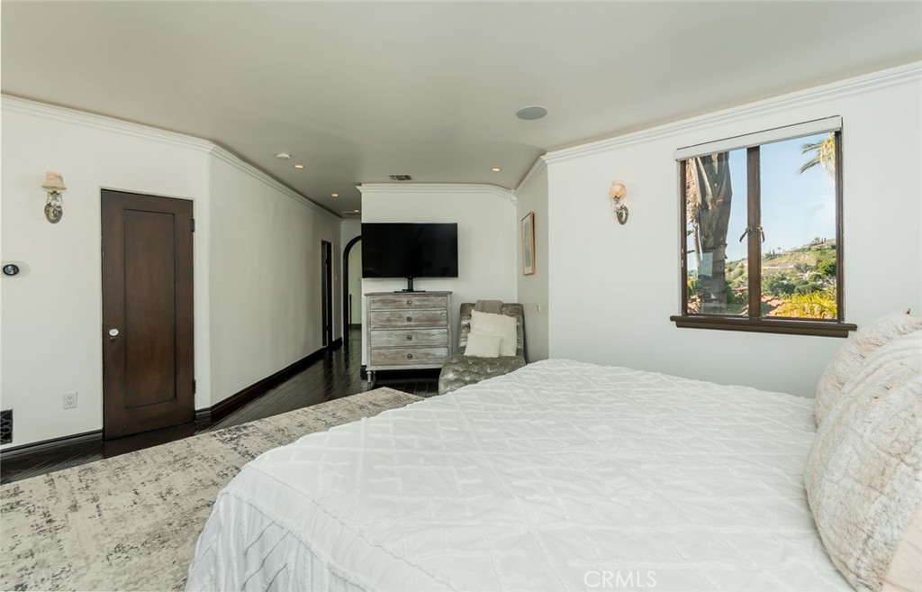 330 Kempton Road Glendale, CA 91202 - Photo 49 of 75 a bedroom with a bed and a flat screen tv