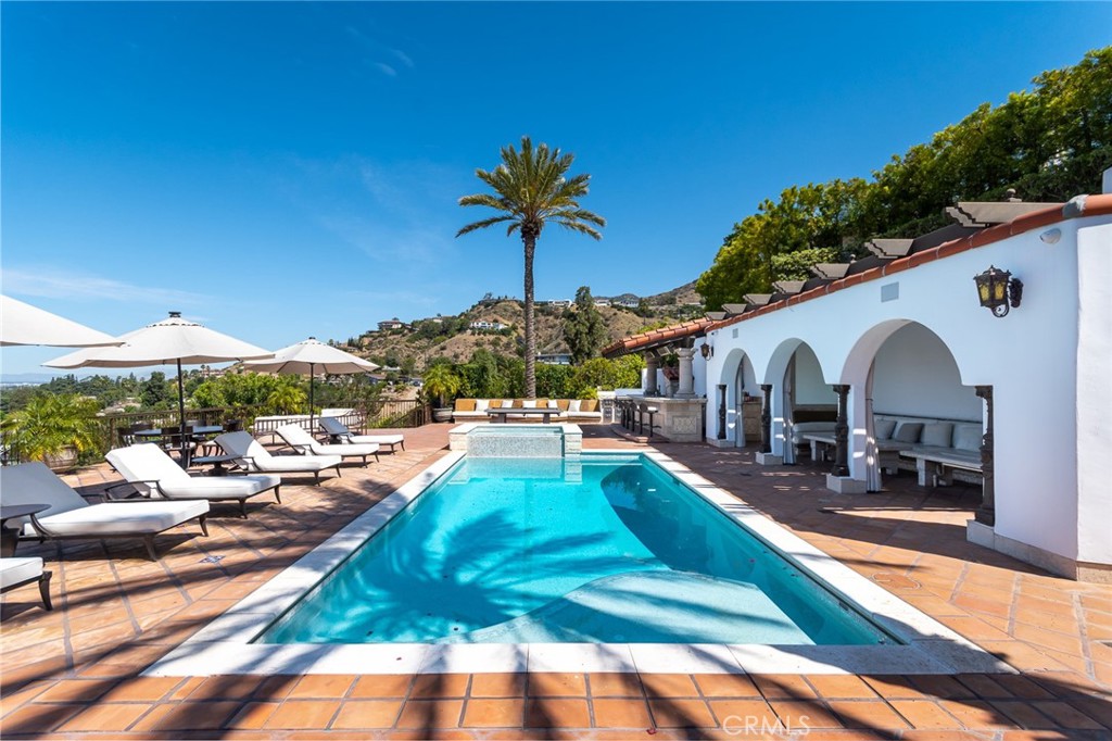 330 Kempton Road Glendale, CA 91202 - Photo 58 of 75 a view of a house with backyard porch and furniture