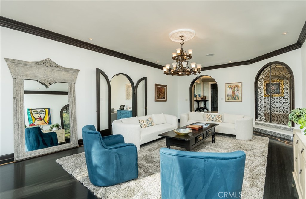 330 Kempton Road Glendale, CA 91202 - Photo 10 of 75 a living room with furniture a chandelier and wooden floor
