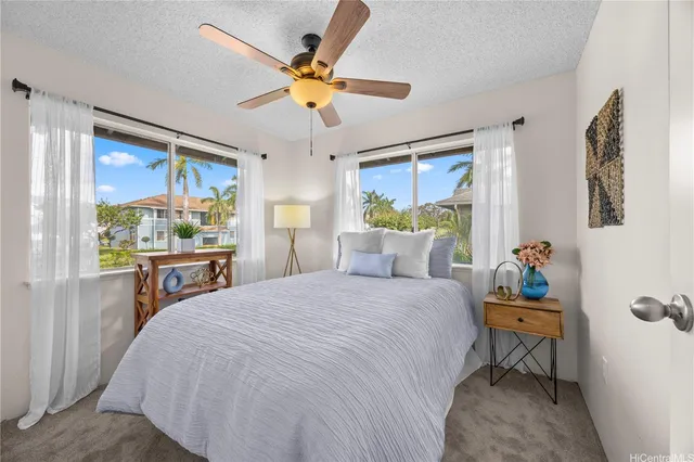 a work room with furniture and a potted plant