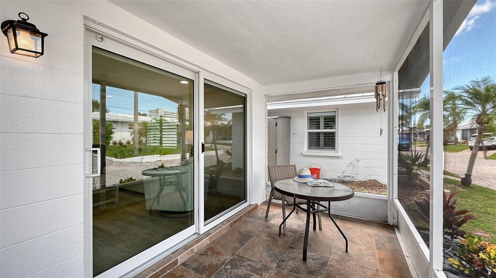 6020 Midnight Pass Road, Unit 63 Sarasota, FL 34242 - Photo 11 of 52 a room with furniture and a potted plant