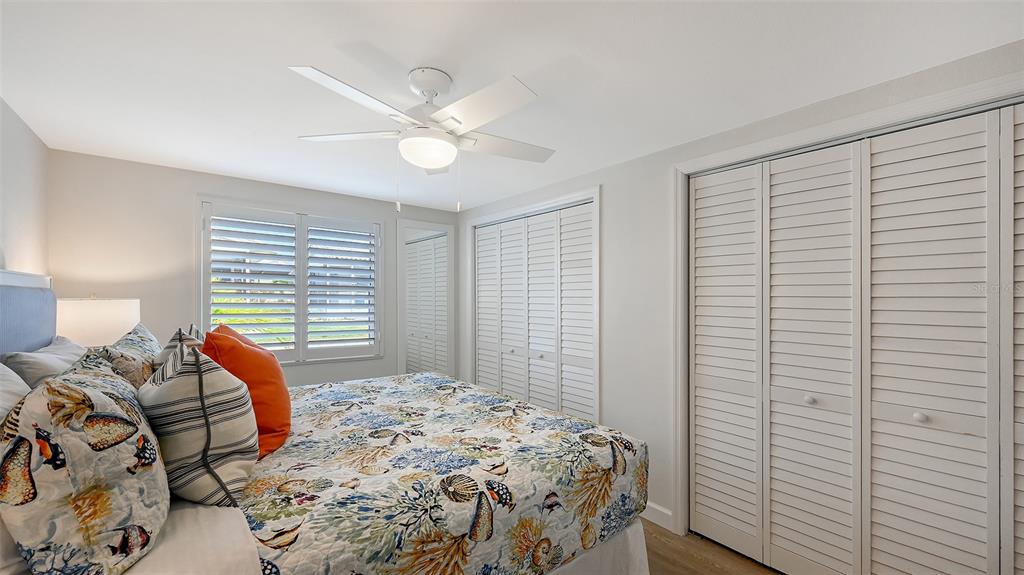 6020 Midnight Pass Road, Unit 63 Sarasota, FL 34242 - Photo 15 of 52 a bedroom with a bed and a window