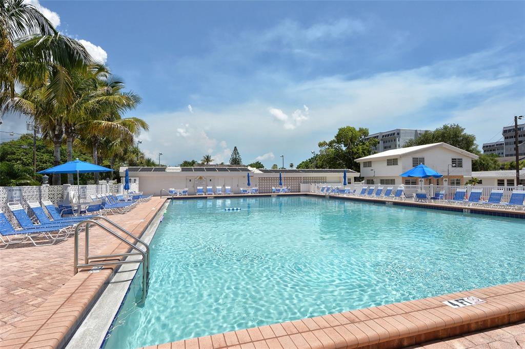6020 Midnight Pass Road, Unit 63 Sarasota, FL 34242 - Photo 27 of 52 an aerial view of a house with swimming pool garden and lake view