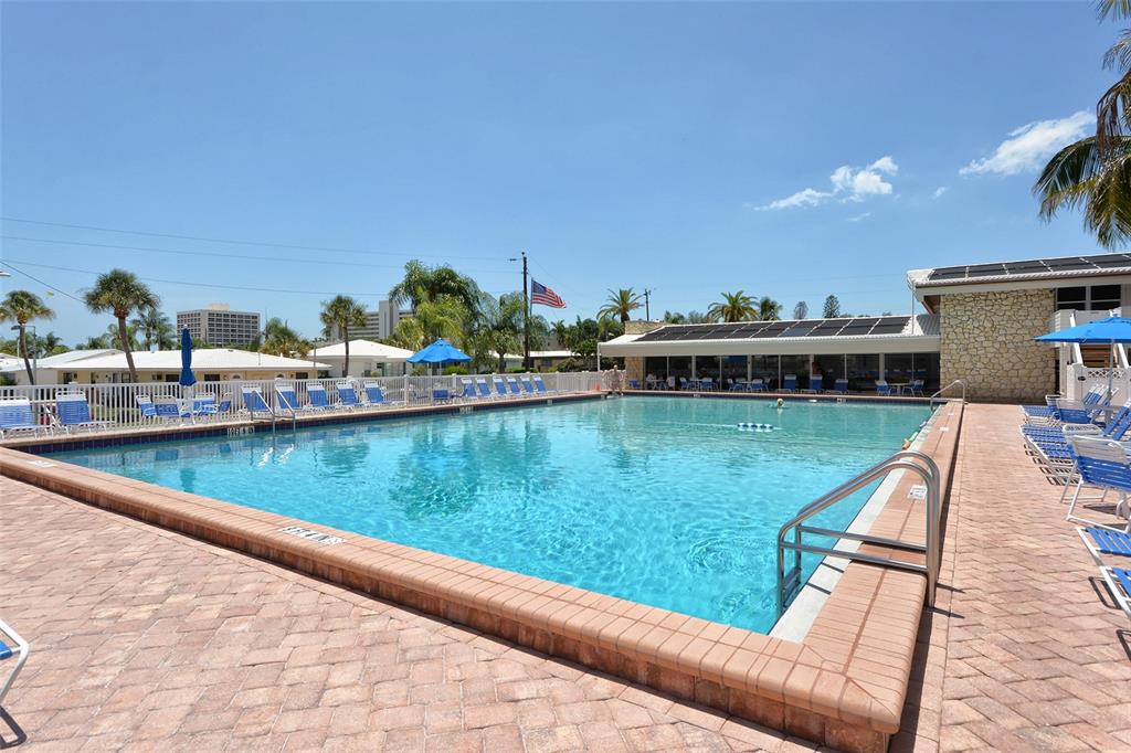 6020 Midnight Pass Road, Unit 63 Sarasota, FL 34242 - Photo 28 of 52 a view of house with swimming pool yard and outdoor seating