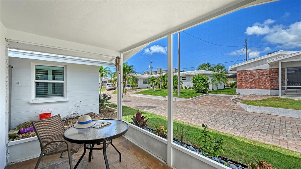 6020 Midnight Pass Road, Unit 63 Sarasota, FL 34242 - Photo 9 of 52 a view of a house with backyard and sitting area