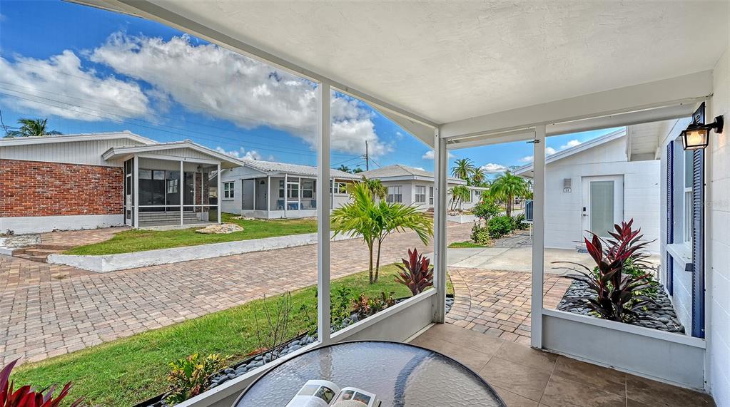 6020 Midnight Pass Road, Unit 63 Sarasota, FL 34242 - Photo 10 of 52 a view of a house with a swimming pool