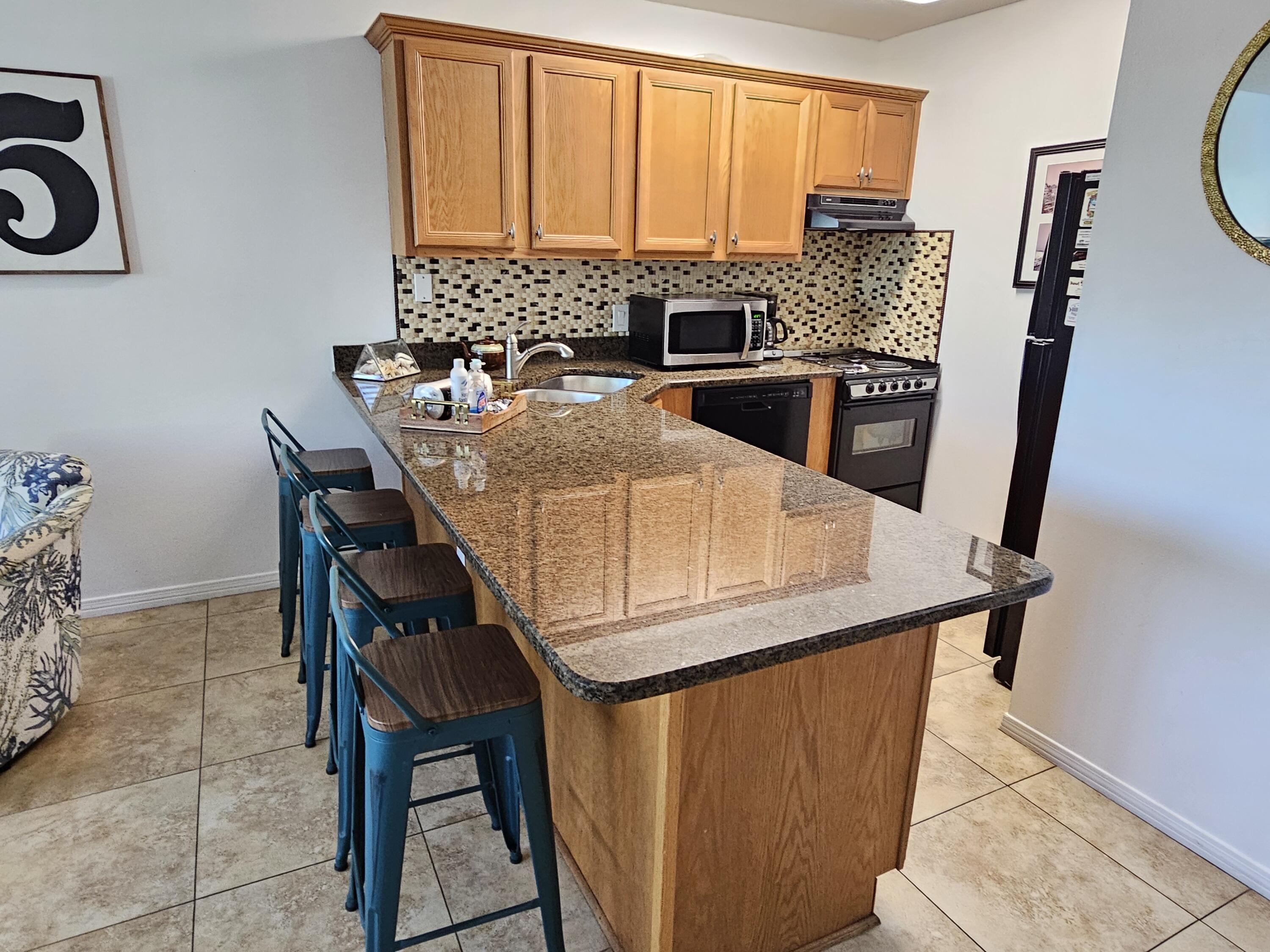 3605 East County Highway 30A, Unit 213 Santa Rosa Beach, FL 32459 - Photo 8 of 31 Granite Counters & Tile Backsplash