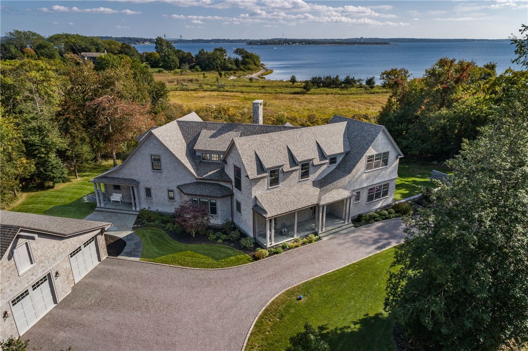Crow’s Nest offers protected unobstructed views and rare deeded Usher Cove beach access in highly desirable POPPASQUASH POINT.