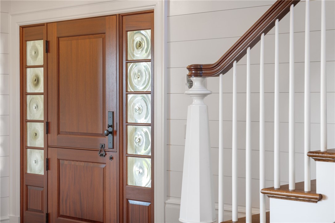 415 Poppasquash Road Bristol, RI 02809 - Photo 13 of 50 Shiplap walls with dutch door surrounded by bullnose glass makes for a truly exquisite and welcoming entrance.