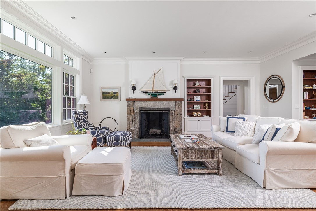 415 Poppasquash Road Bristol, RI 02809 - Photo 14 of 50 Living room features beautiful millwork and custom built-ins.