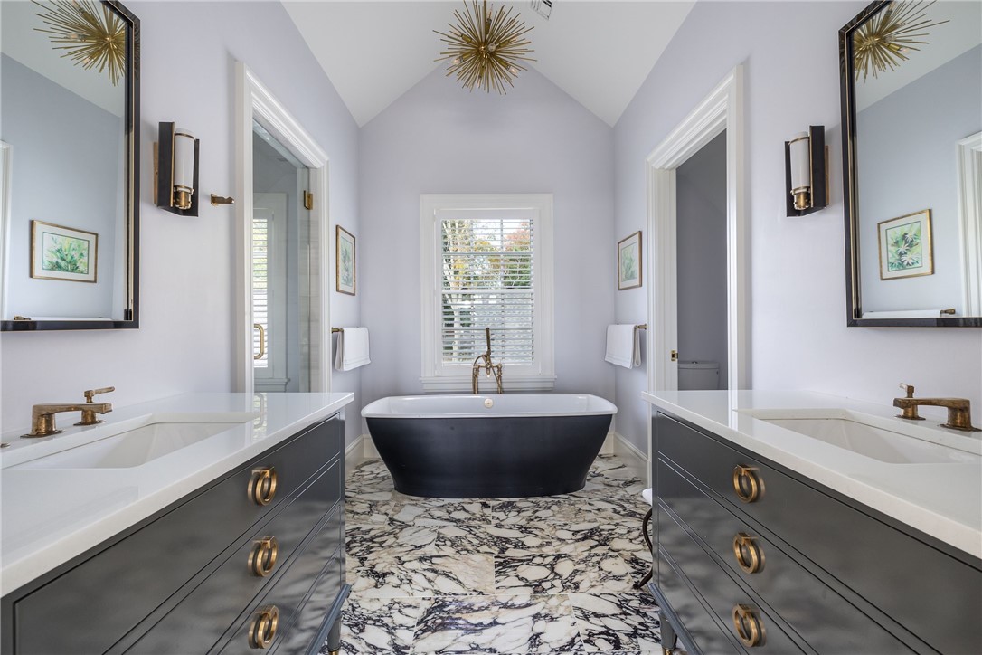 415 Poppasquash Road Bristol, RI 02809 - Photo 33 of 50 The second level master has an en-suite bathroom with a steam shower, soaking tub and heated floors.