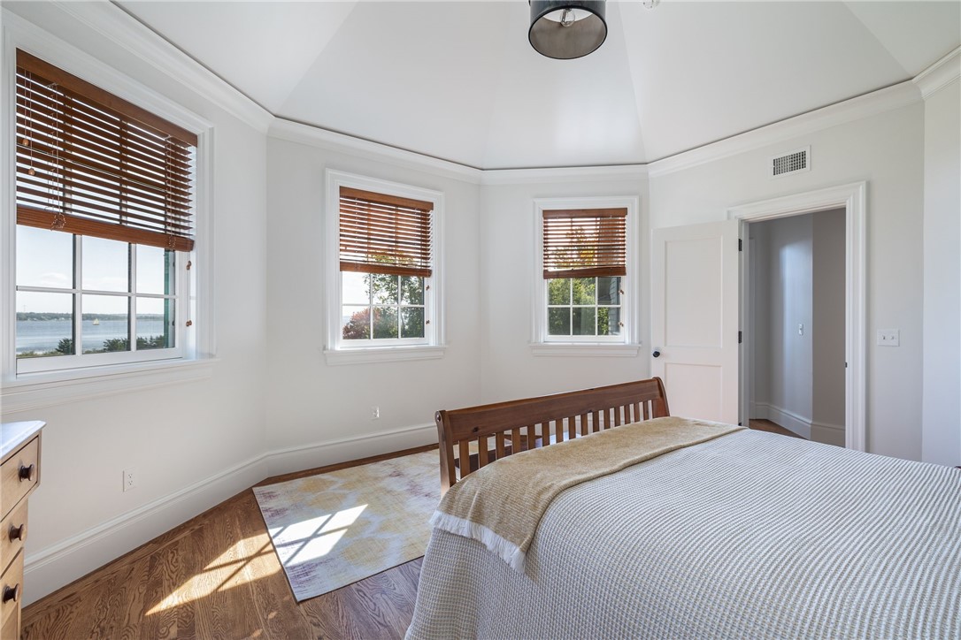 415 Poppasquash Road Bristol, RI 02809 - Photo 37 of 50 3rd Bedroom with special architectural detail and water views. Located on the second level.
