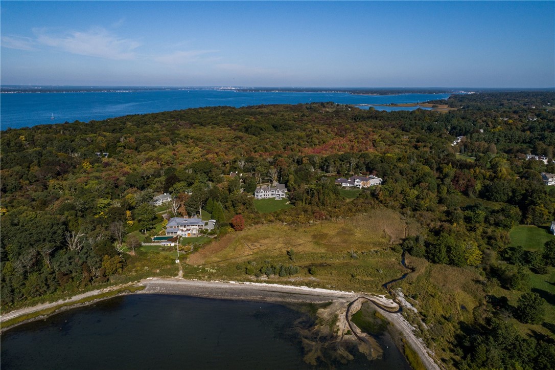415 Poppasquash Road Bristol, RI 02809 - Photo 8 of 50 Aerial of Crow's Nest facing Usher Cove beach and Narragansett Bay in the distance.
