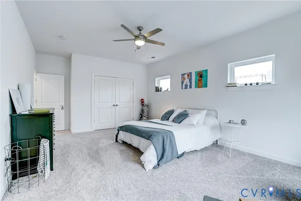 a bedroom with a bed and a table