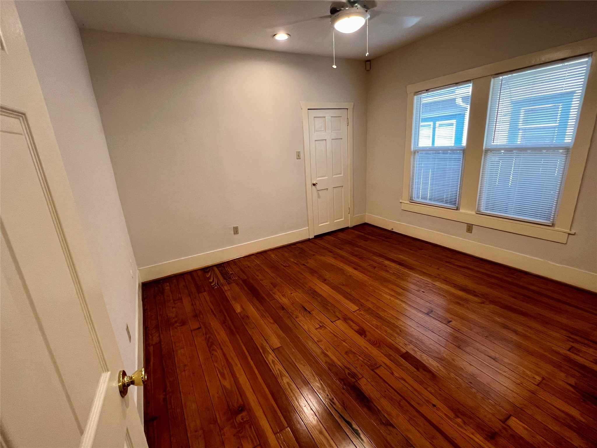 501 East 28th Street Houston, TX 77008 - Photo 13 of 20 a view of an empty room with wooden floor and fan