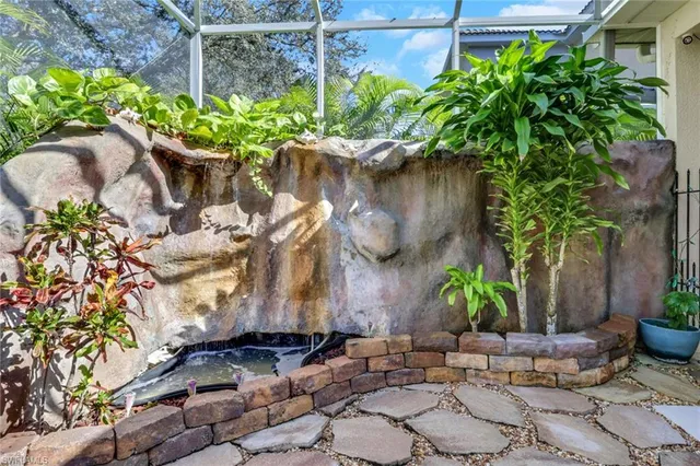 a couple of potted plants in front of door