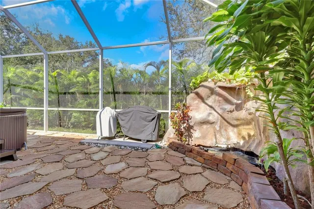 a view of a floor to ceiling window and wooden fence