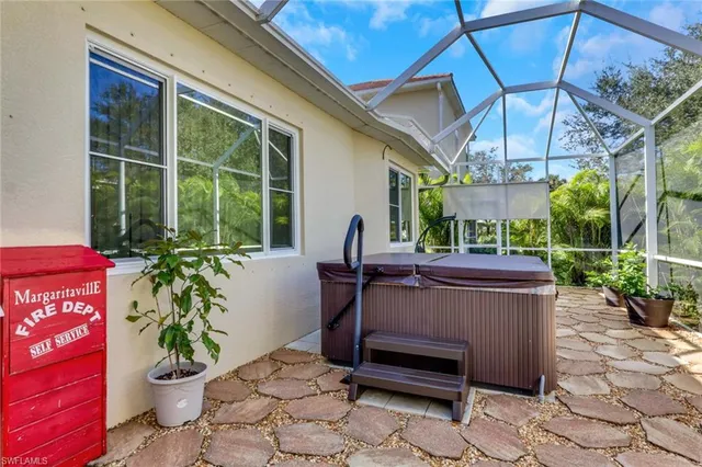 a view of a patio with table and chairs potted plants