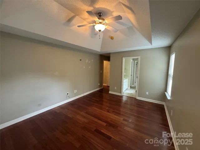 a bathroom with a sink double vanity granite tub shower and a mirror