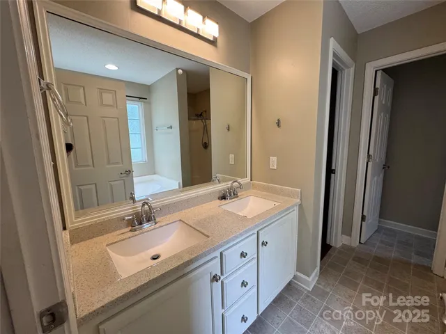 a white bath tub sitting next to a window