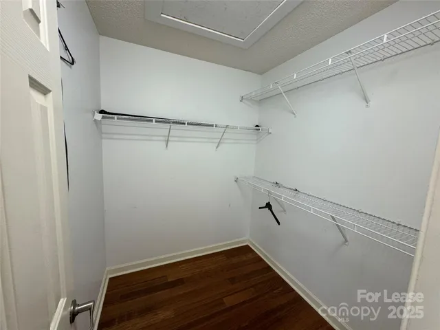 a bathroom with a glass door shower and a mirror