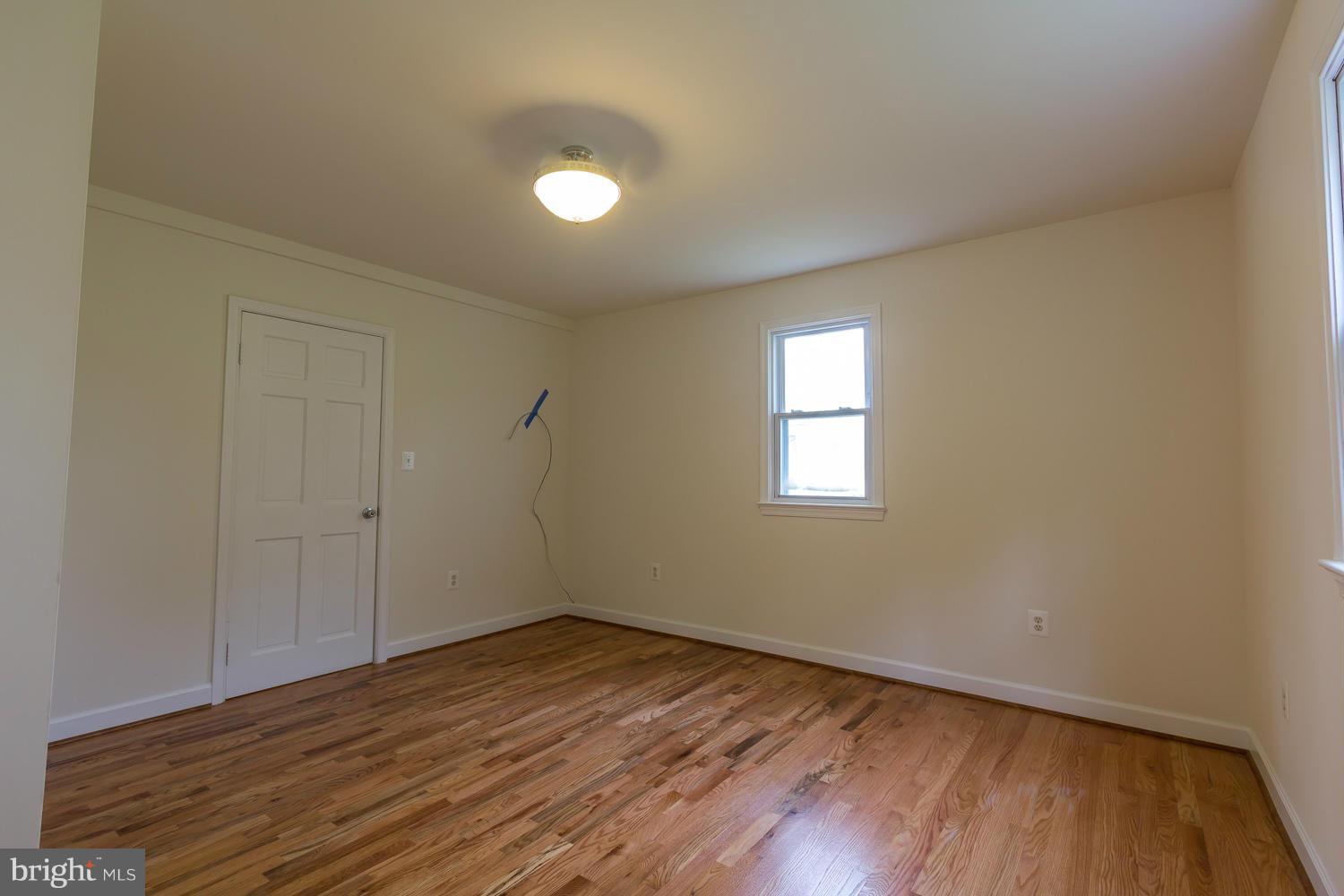 4503 Mahan Road Silver Spring, MD 20906 - Photo 11 of 25 a view of a room with wooden floor and window