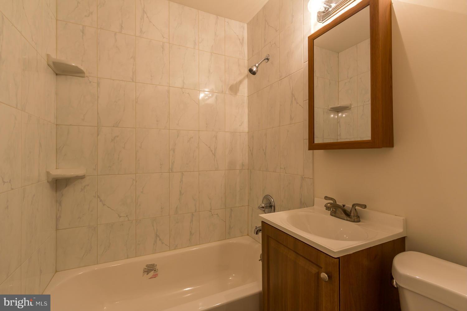 4503 Mahan Road Silver Spring, MD 20906 - Photo 13 of 25 a bathroom with a sink toilet and shower
