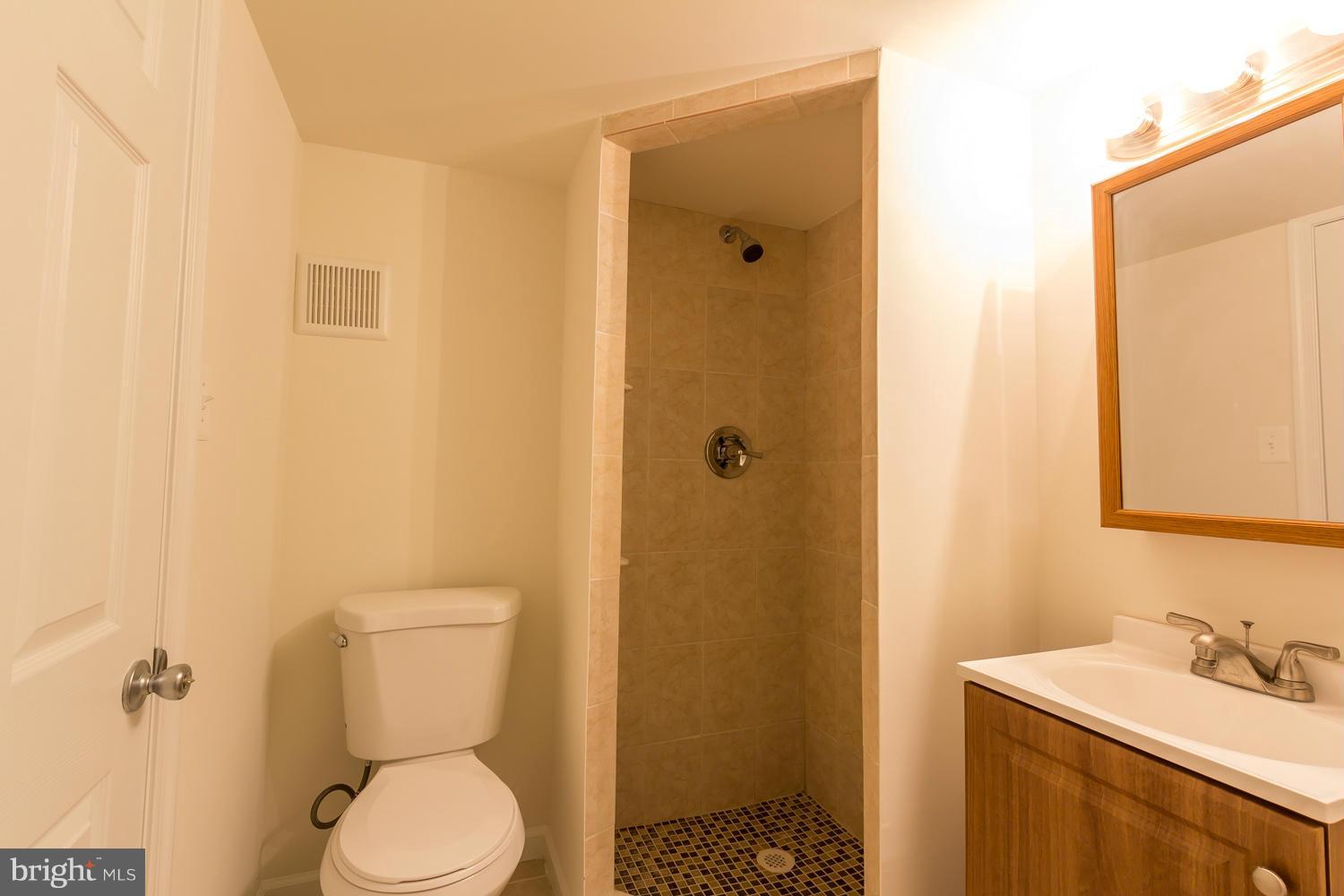 4503 Mahan Road Silver Spring, MD 20906 - Photo 22 of 25 a bathroom with a sink a toilet and shower