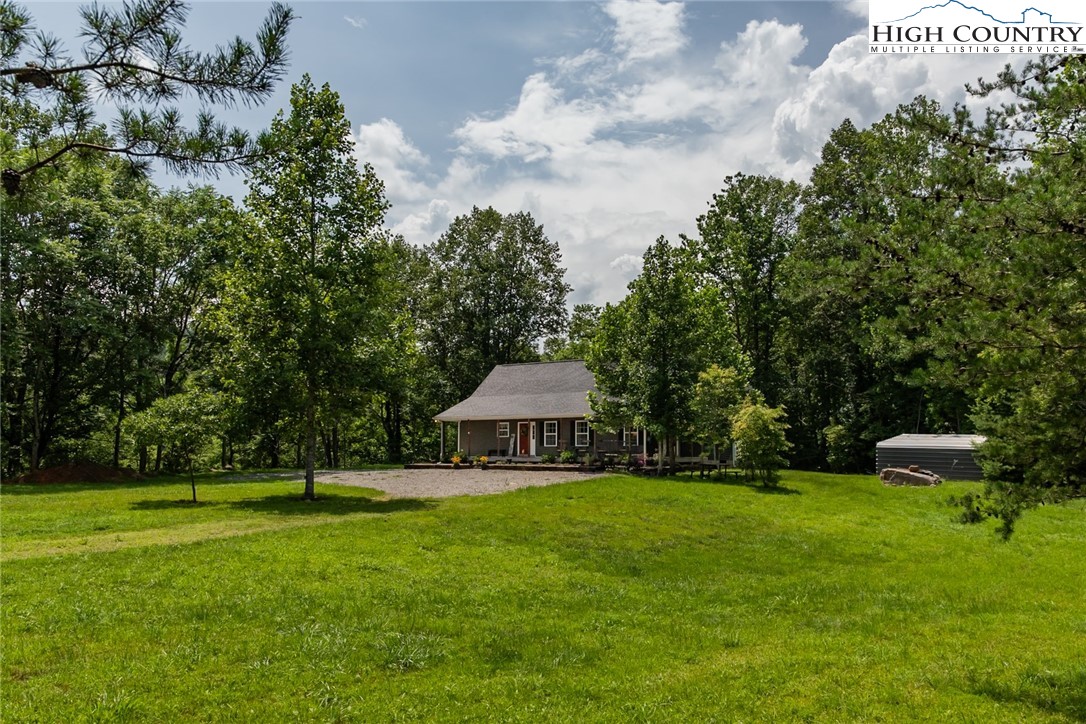 351 Colony Lane Purlear, NC 28665 - Photo 17 of 39 a view of a house with a yard