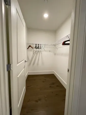 a bathroom with a double vanity sink toilet and a mirror