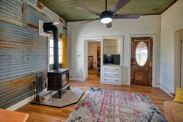 a view of an entryway of a house with wooden floor