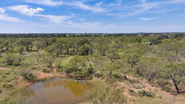 a view of a lake with a building in the background