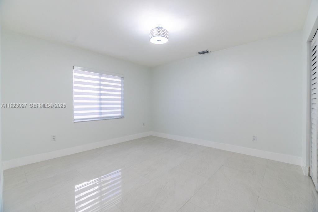 3425 Southwest 69th Avenue Miami, FL 33155 - Photo 22 of 40 an empty room with a window