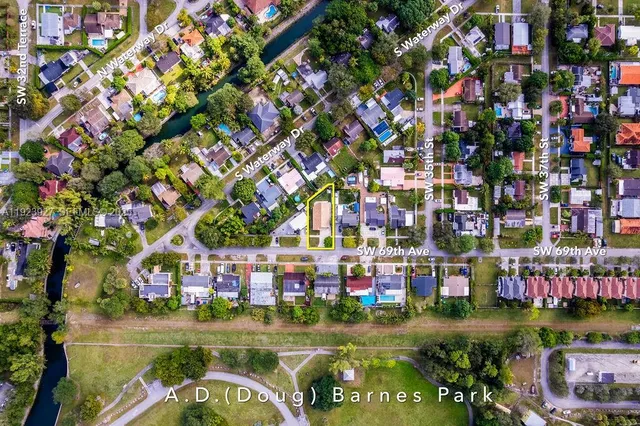 a aerial view of a house with a yard