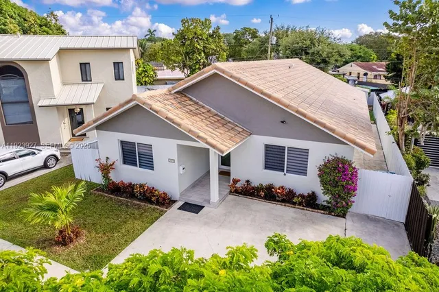 an aerial view of multiple houses with outdoor space
