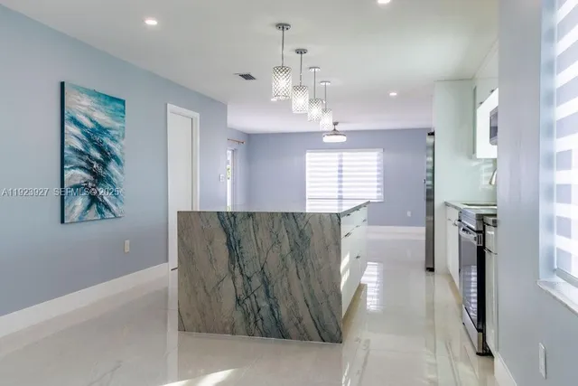 a view of kitchen and windows