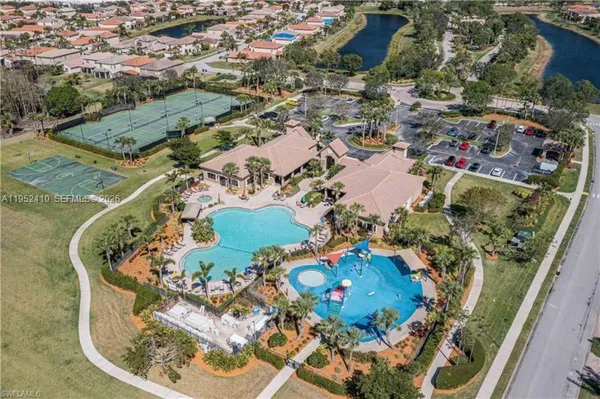an aerial view of a house with a swimming pool