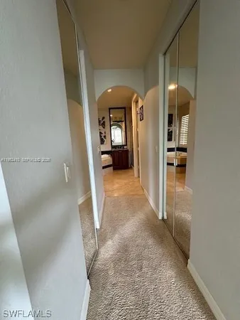 a view of a hallway view with staircase