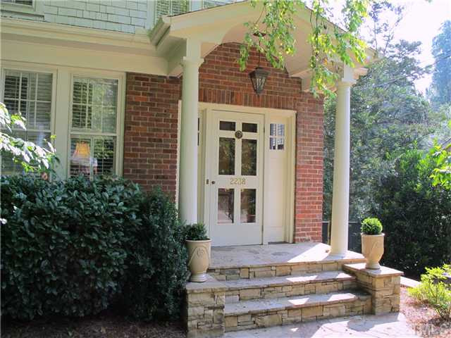 2238 The Circle Raleigh, NC 27608 - Photo 2 of 23 2008 Front Stone Porch, Walk, & Wall Running Along Pea Gravel Driveway. Porch