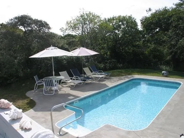 a view of swimming pool with sitting area