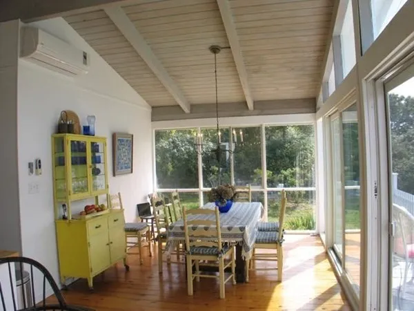 a view of a dining room with furniture window and outside view