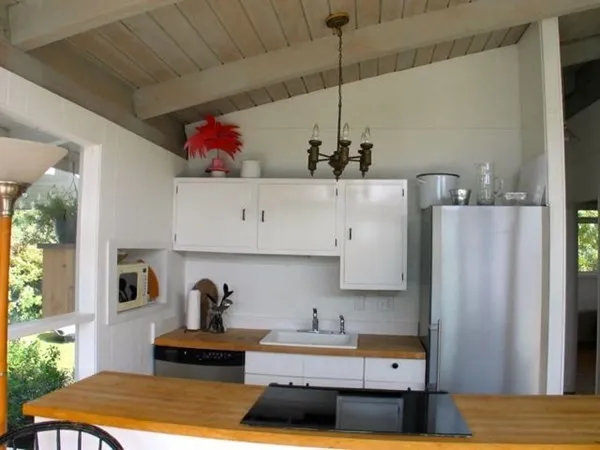 a kitchen with a sink and refrigerator
