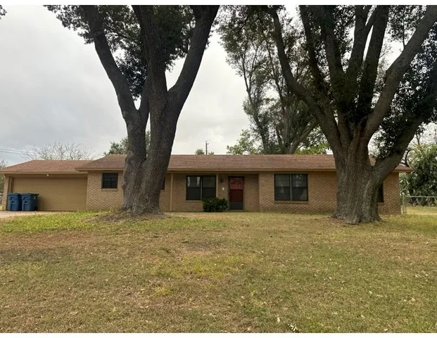a house with trees in front of it