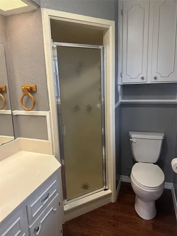 a view of wooden floor and windows in a room