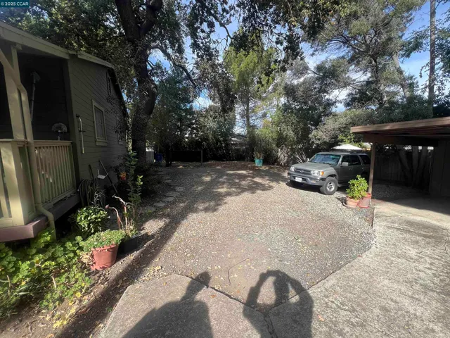 a view of a backyard with a sitting area