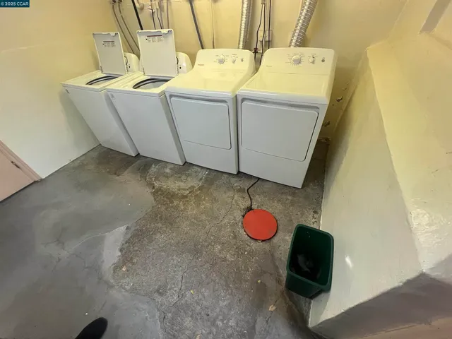 a view of backyard with outdoor seating and plants