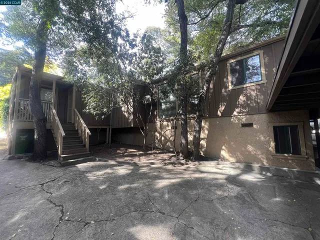 a kitchen with stainless steel appliances a refrigerator and a stove
