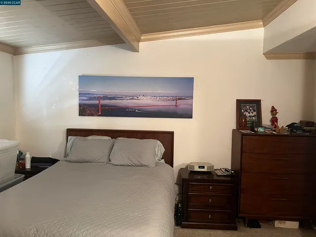 a view of backyard with deck and outdoor seating