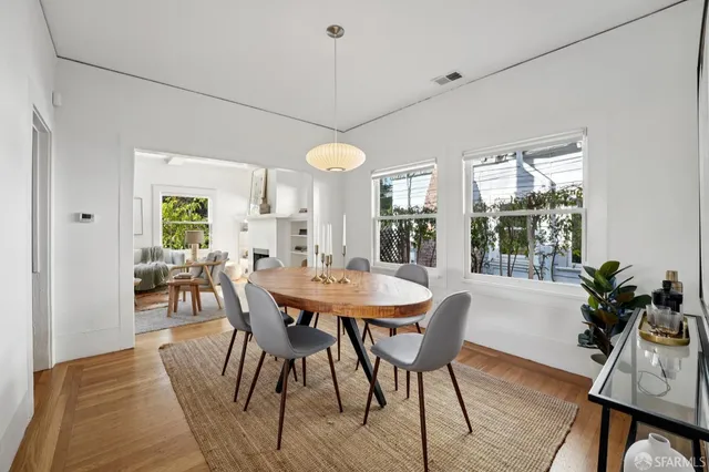 a kitchen with stainless steel appliances kitchen island granite countertop a refrigerator and microwave