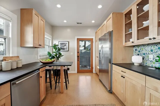 a bed room with a bed mirror and a chandelier